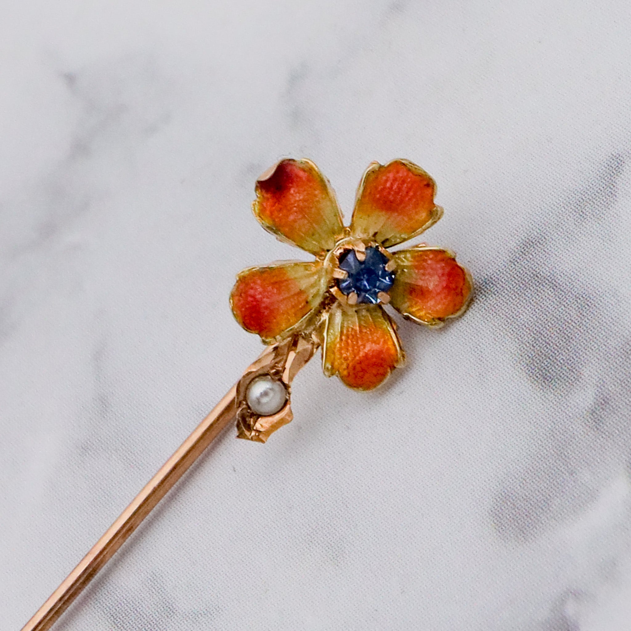 Antique Nouveau 10k gold, enamel, split pearl & faux sapphire stick pin